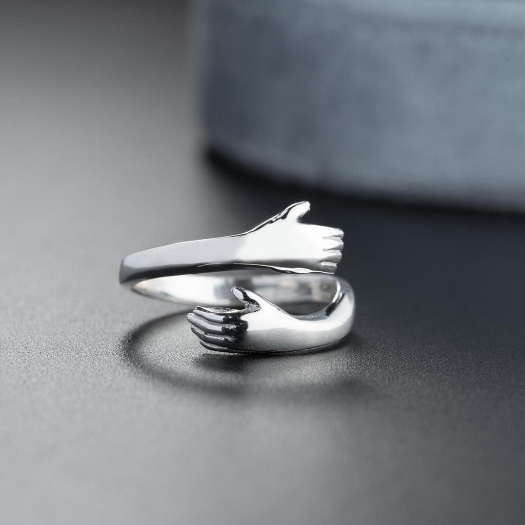 HOLDING HAND RING